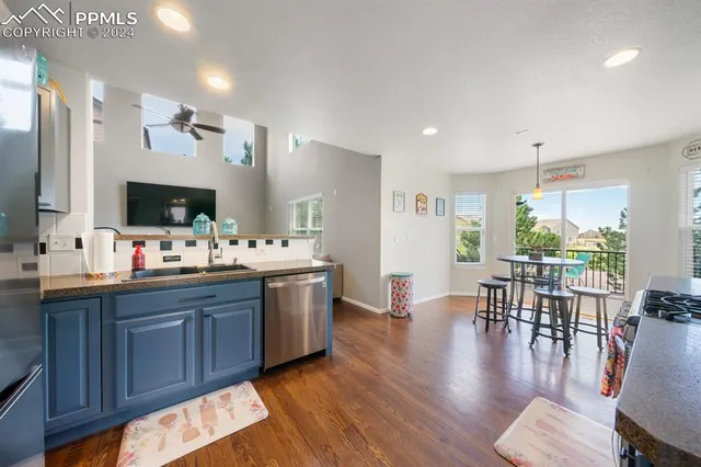 a large room with lots of counter space and windows