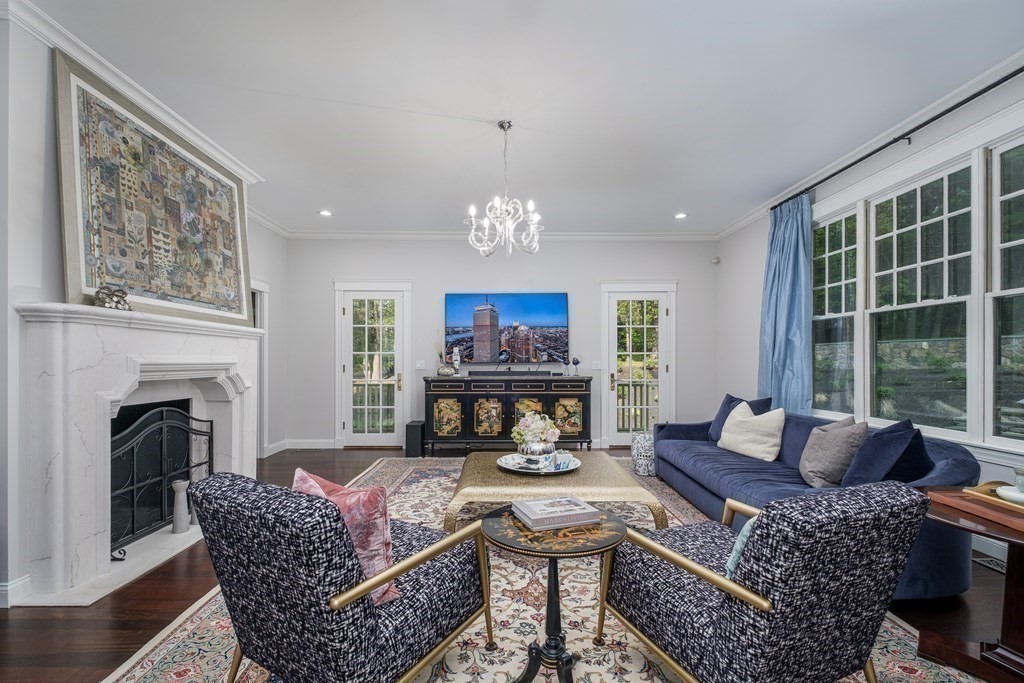 59 Crestview Road Milton, MA 02186 - Photo 11 of 42 a living room with furniture a fireplace and a large window