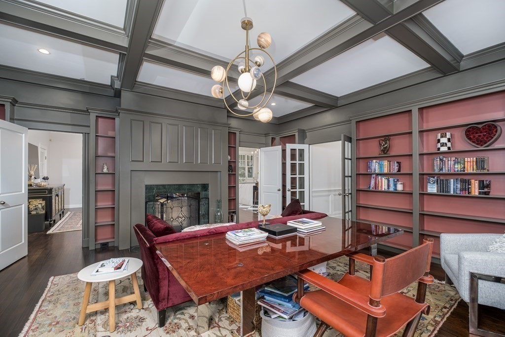59 Crestview Road Milton, MA 02186 - Photo 13 of 42 a living room with furniture a chandelier and a fireplace