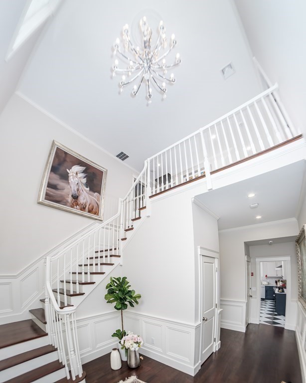 59 Crestview Road Milton, MA 02186 - Photo 15 of 42 a view of entryway and hall with wooden floor