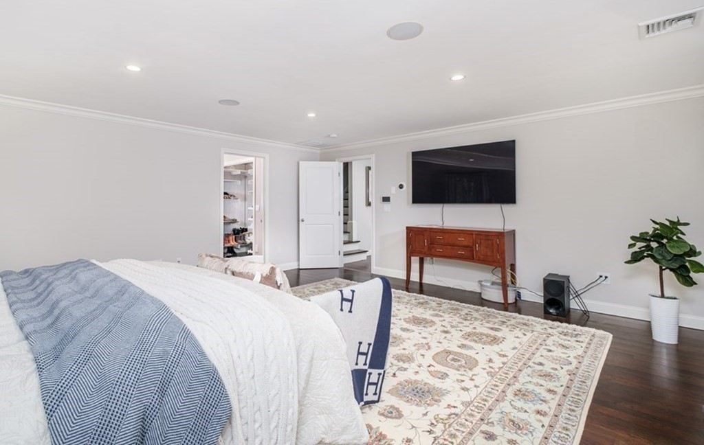 59 Crestview Road Milton, MA 02186 - Photo 17 of 42 a bed room with a bed a television and a couch