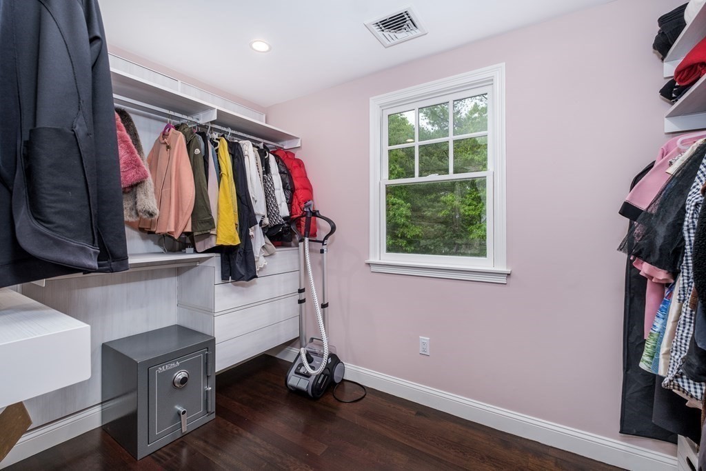 59 Crestview Road Milton, MA 02186 - Photo 18 of 42 a view of walk in closet with clothes and shoes