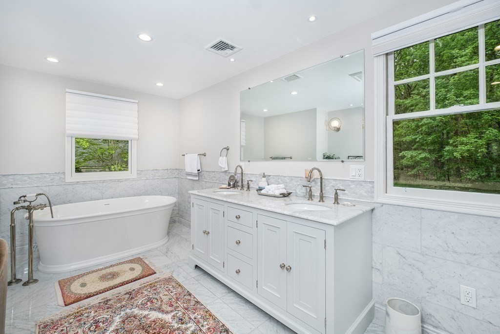 59 Crestview Road Milton, MA 02186 - Photo 19 of 42 a bathroom with a granite countertop sink mirror and a bathtub