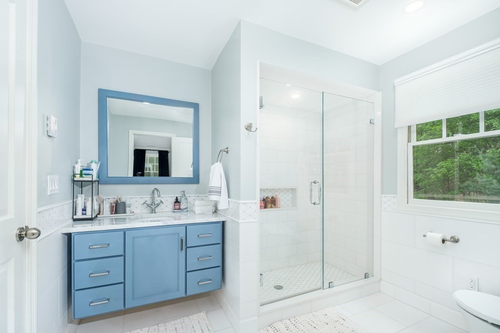 59 Crestview Road Milton, MA 02186 - Photo 22 of 42 a bathroom with a double vanity sink toilet mirror and bathtub