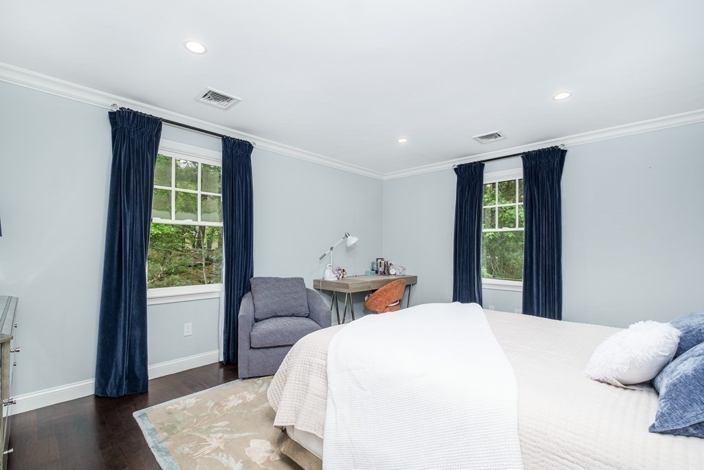 59 Crestview Road Milton, MA 02186 - Photo 23 of 42 a bedroom with a large bed and wooden floor