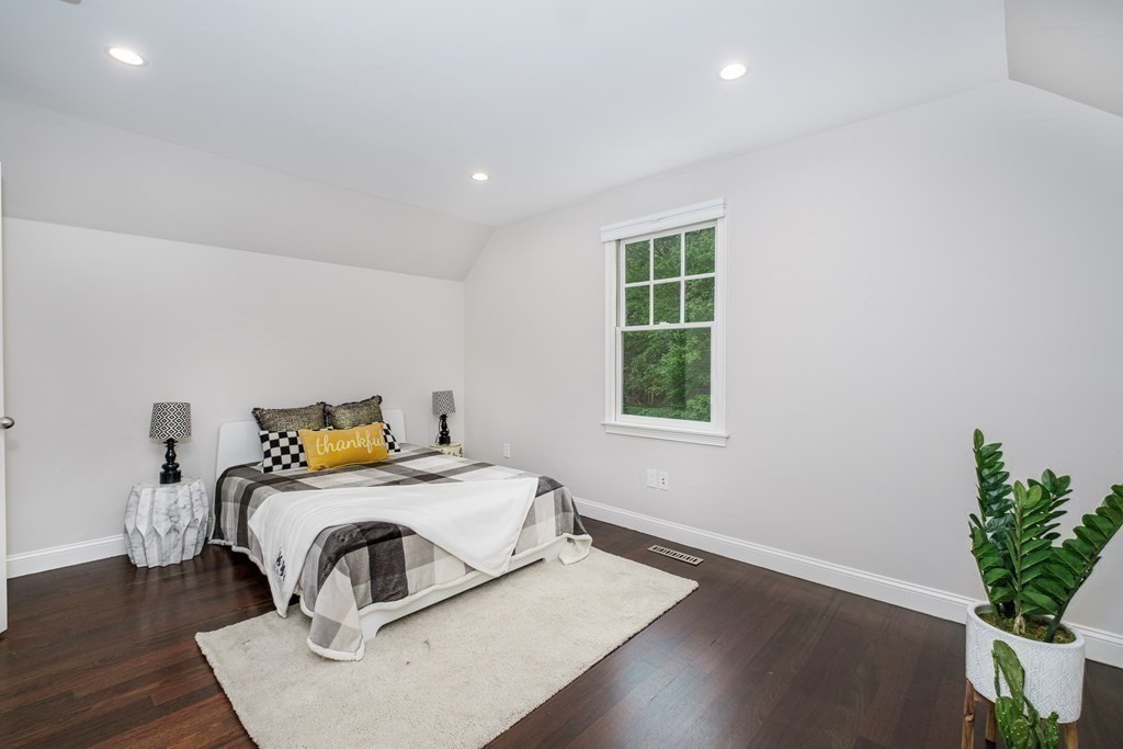59 Crestview Road Milton, MA 02186 - Photo 28 of 42 a bedroom with a bed and a potted plant
