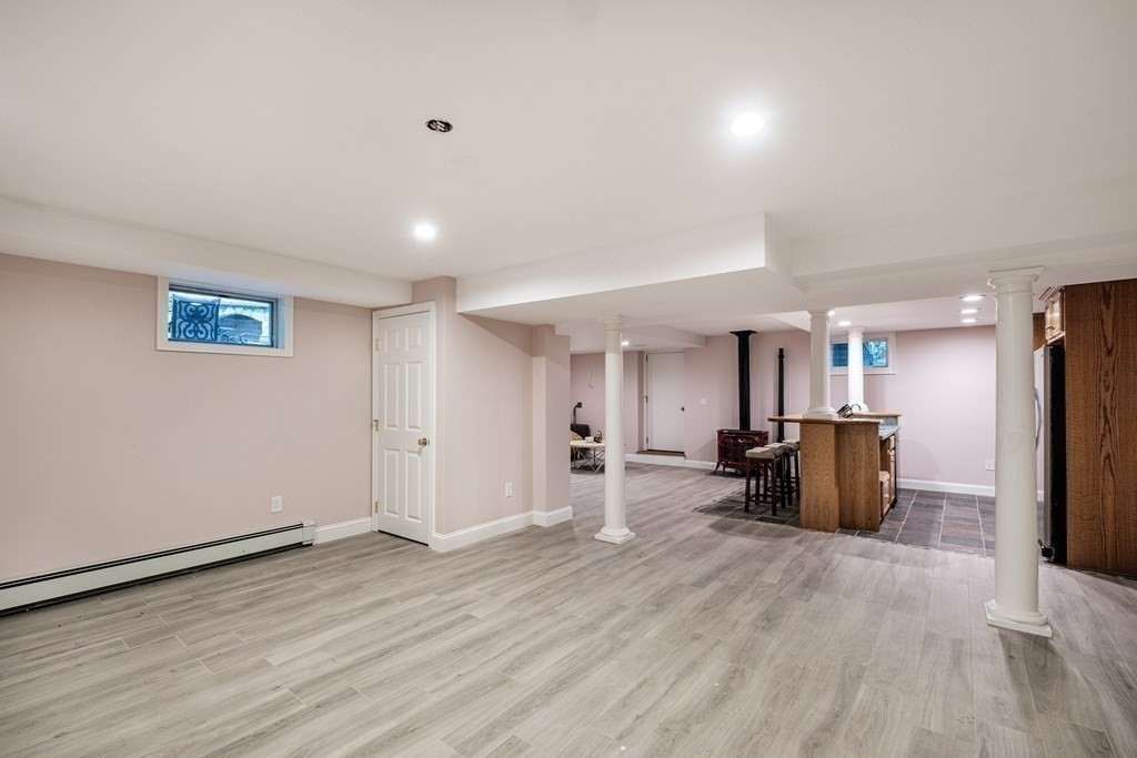 59 Crestview Road Milton, MA 02186 - Photo 29 of 42 an empty room with wooden floor and windows