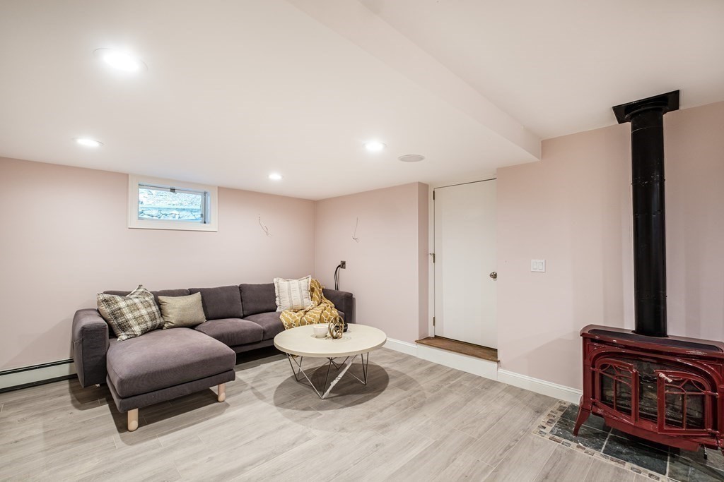 59 Crestview Road Milton, MA 02186 - Photo 31 of 42 a living room with furniture and a couch