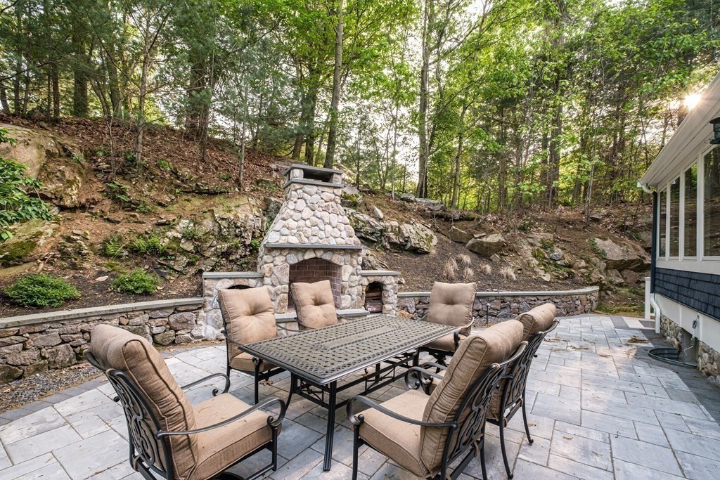 59 Crestview Road Milton, MA 02186 - Photo 37 of 42 a view of a patio with table and chairs and potted plants