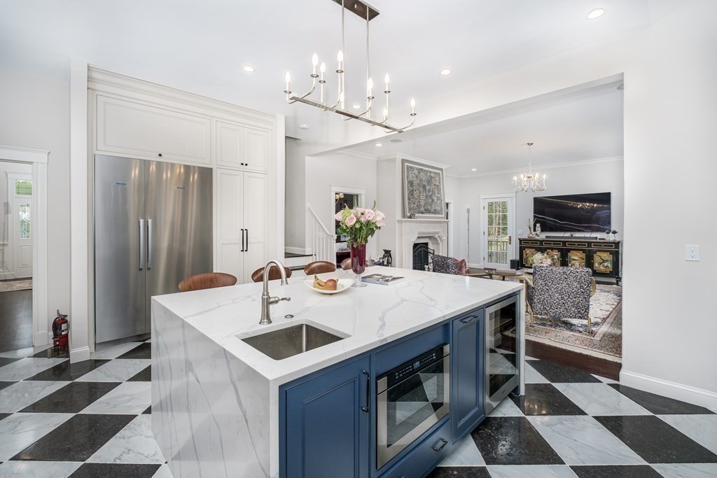 59 Crestview Road Milton, MA 02186 - Photo 6 of 42 a view of kitchen island a sink and a refrigerator