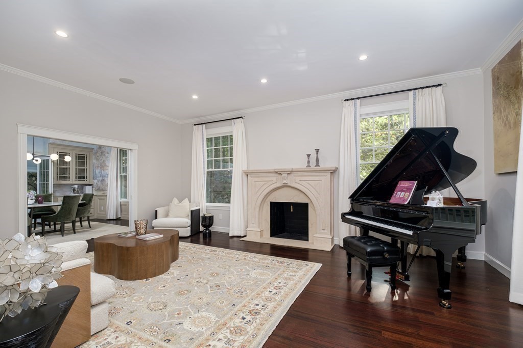 59 Crestview Road Milton, MA 02186 - Photo 7 of 42 a living room with furniture a fireplace and a flat screen tv