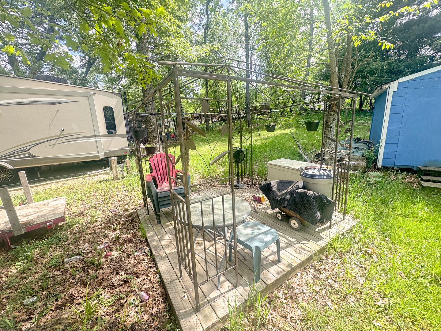 7-98 Woodhaven Sublette, IL 61367 - Photo 5 of 23 a view of a chair and tables in the patio