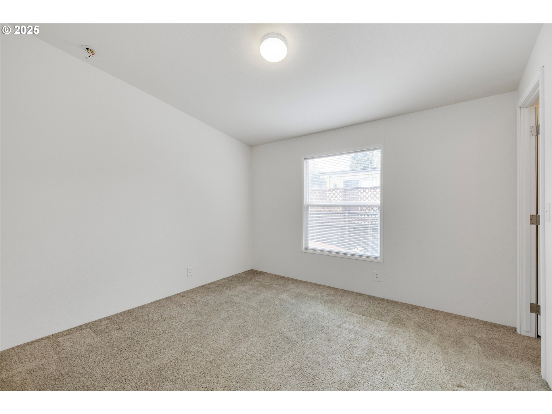 21100 Northeast Sandy Boulevard, Unit 39 Fairview, OR 97024 - Photo 16 of 23 a view of an empty room with a window