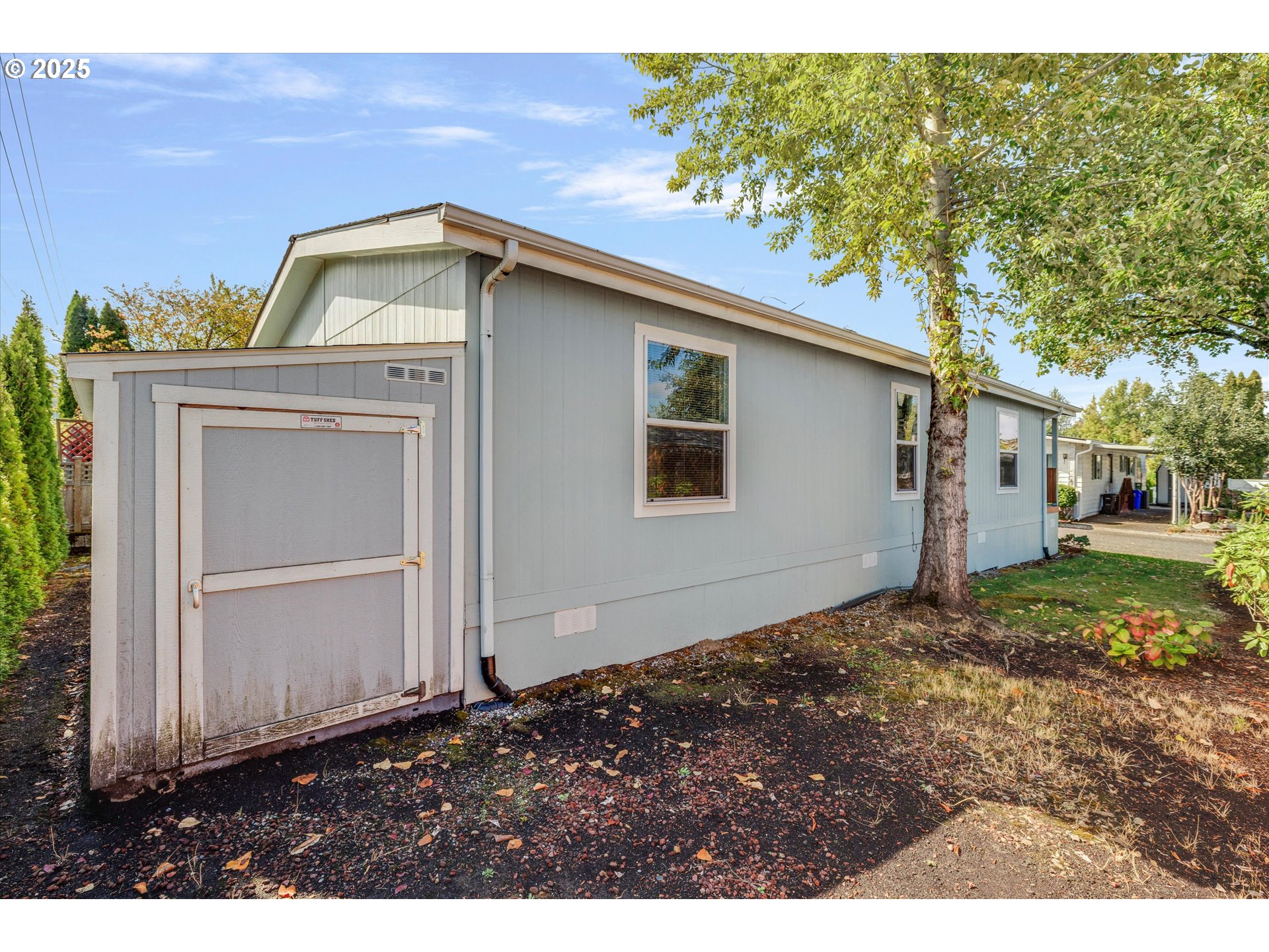 21100 Northeast Sandy Boulevard, Unit 39 Fairview, OR 97024 - Photo 21 of 23 a front view of a house with a yard