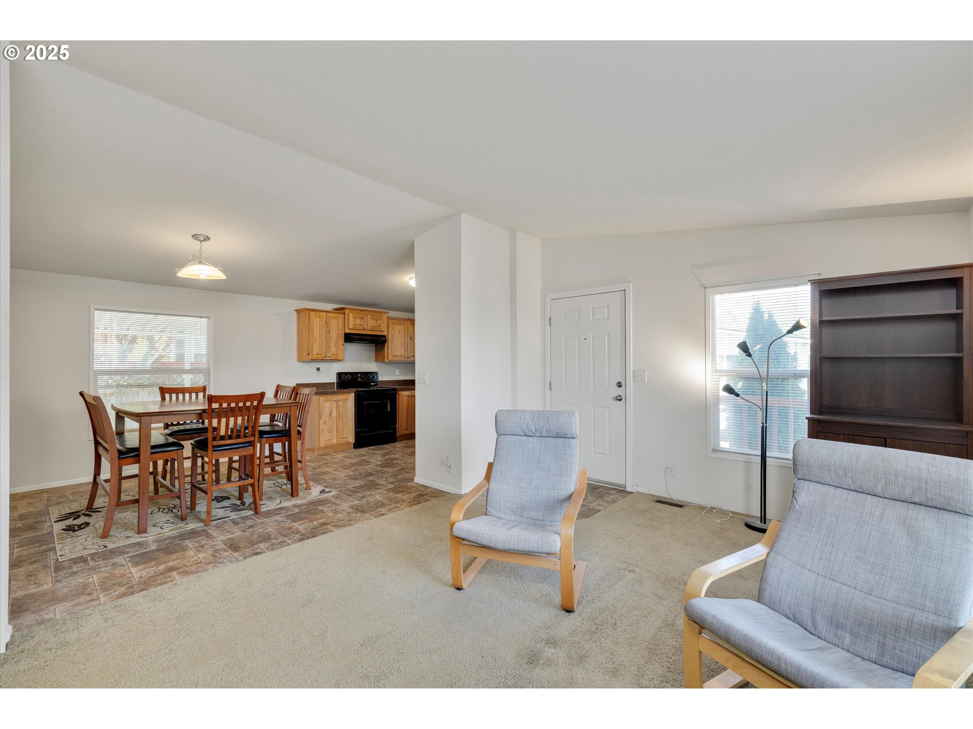 21100 Northeast Sandy Boulevard, Unit 39 Fairview, OR 97024 - Photo 5 of 23 a living room with furniture and kitchen view