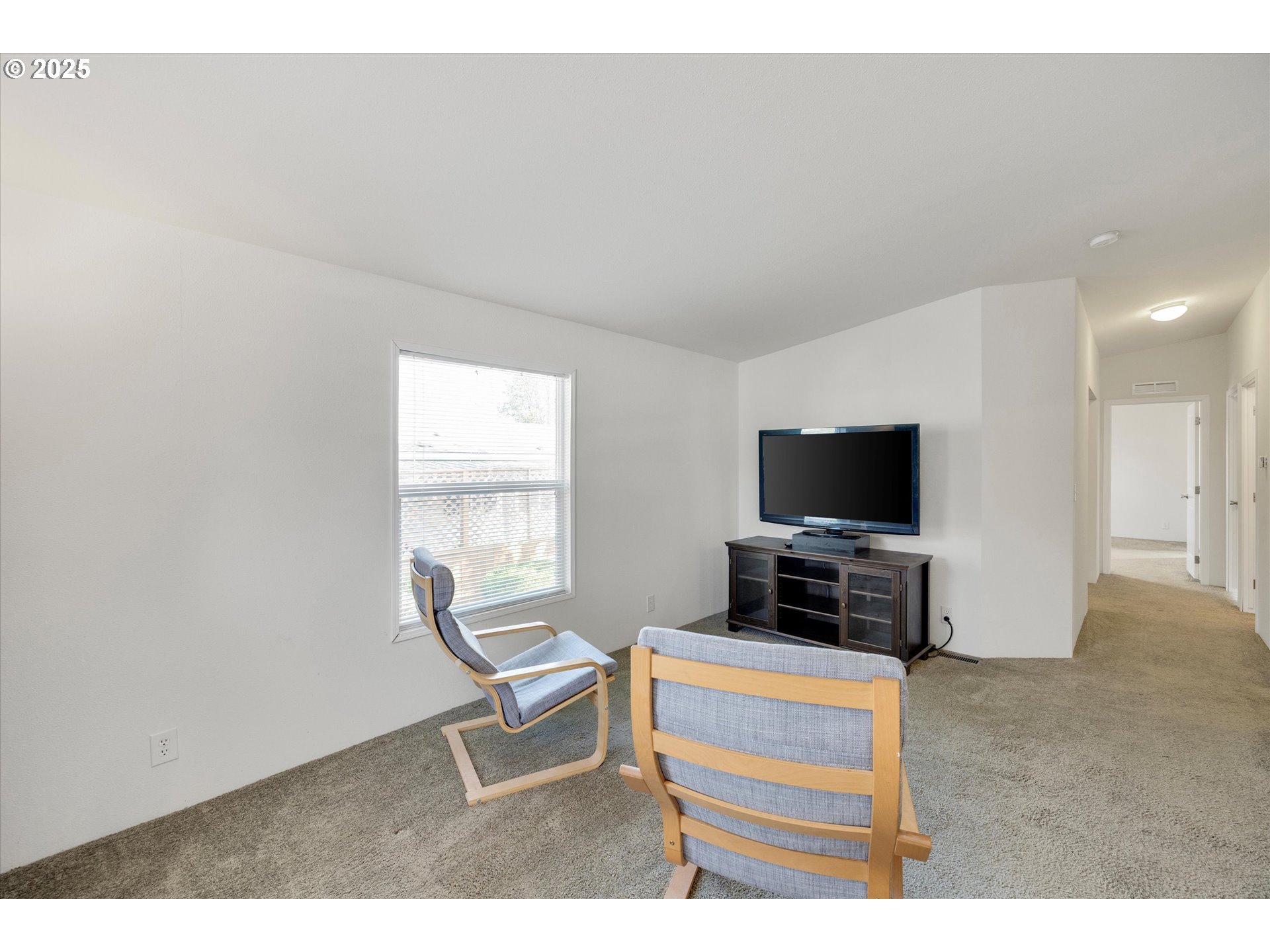 21100 Northeast Sandy Boulevard, Unit 39 Fairview, OR 97024 - Photo 6 of 23 a living room with furniture and a flat screen tv