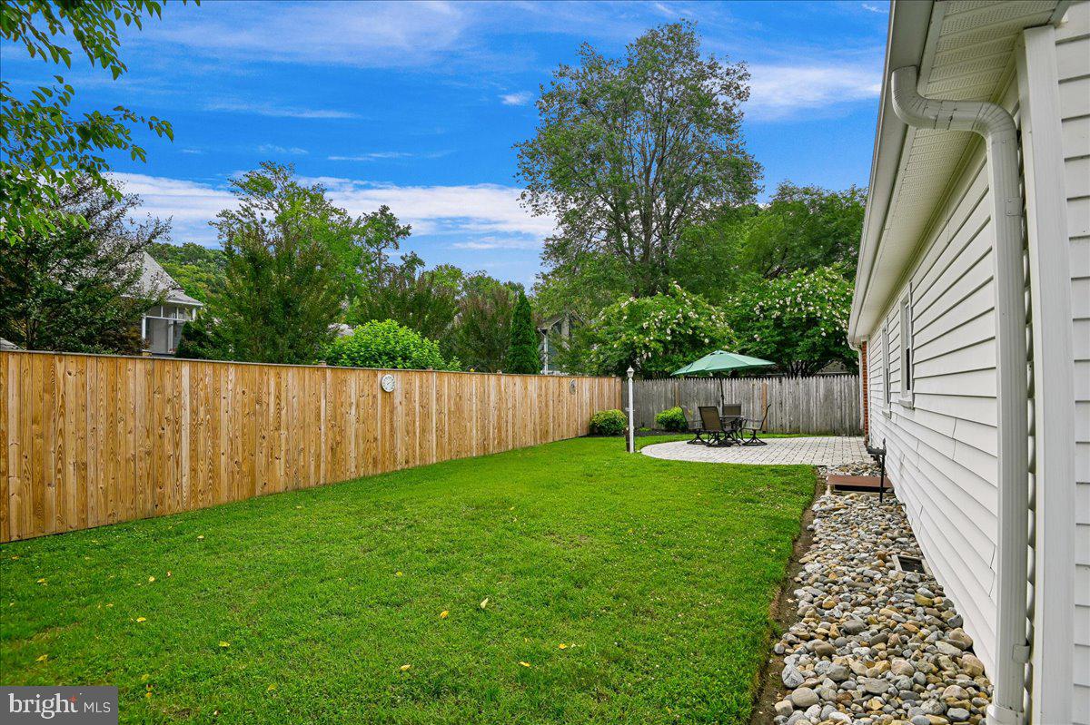 1731 Tacoma Road Edgewater, MD 21037 - Photo 15 of 59 Serene backyard oasis with lush greenery.