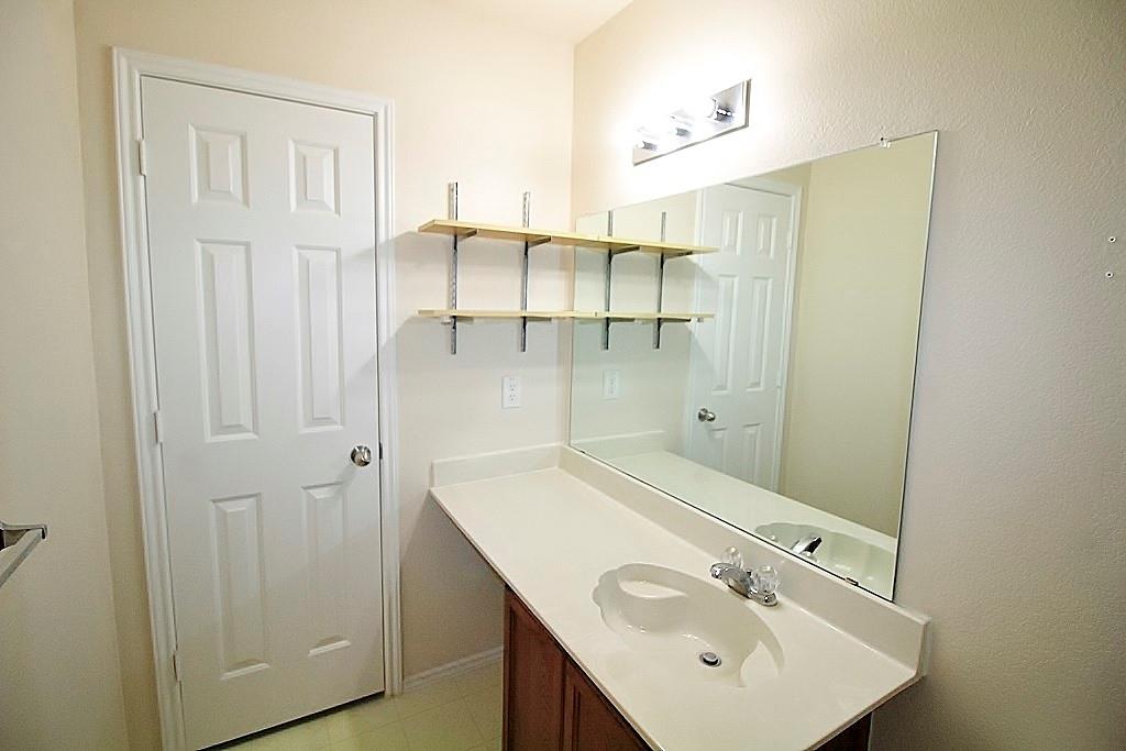 1920 J J Cheshier Road Fort Worth, TX 76247 - Photo 13 of 21 a bathroom with a sink and mirror