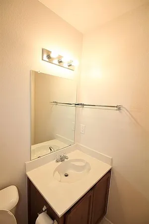 a bathroom with a sink and mirror