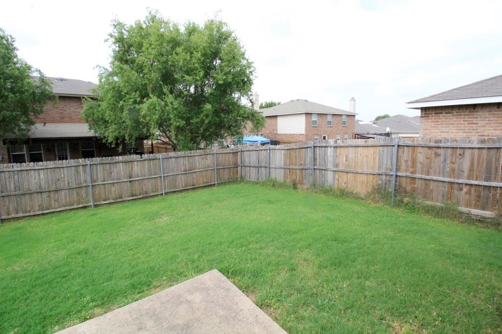 1920 J J Cheshier Road Fort Worth, TX 76247 - Photo 20 of 21 a view of a backyard with a garden
