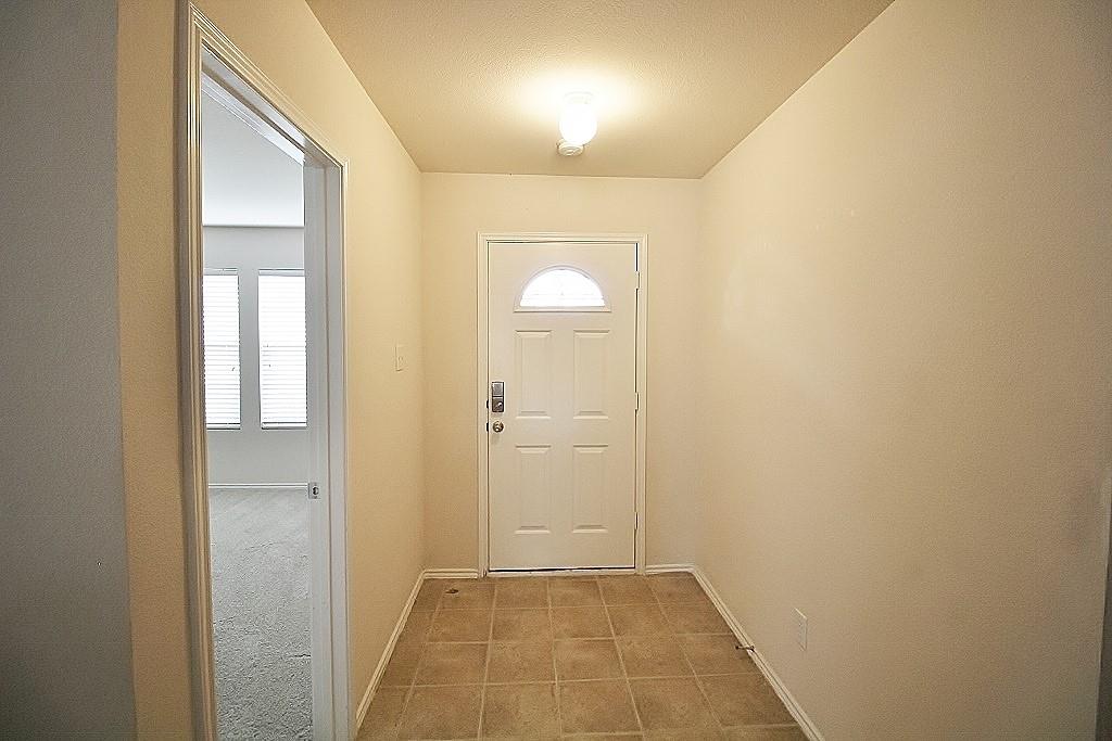 1920 J J Cheshier Road Fort Worth, TX 76247 - Photo 2 of 21 a view of a hallway with wooden floor