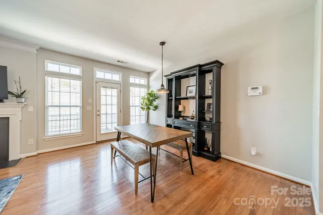 a livingroom with furniture window and wooden floor