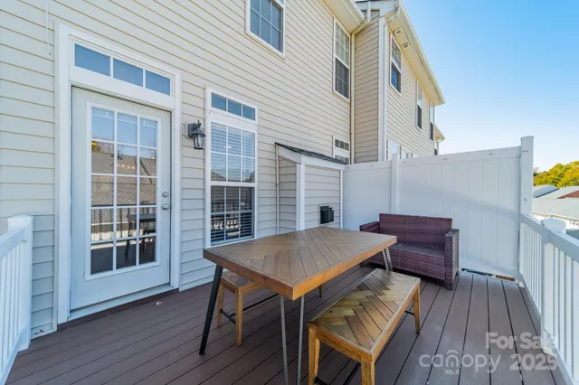 a view of a wooden chairs on the deck