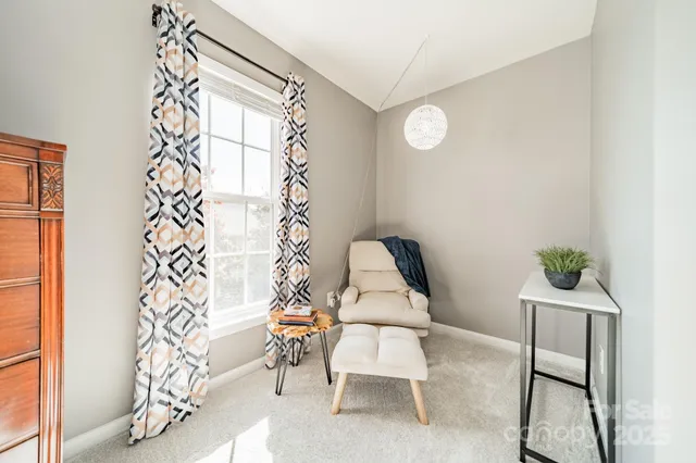 a view of entryway with table and chairs