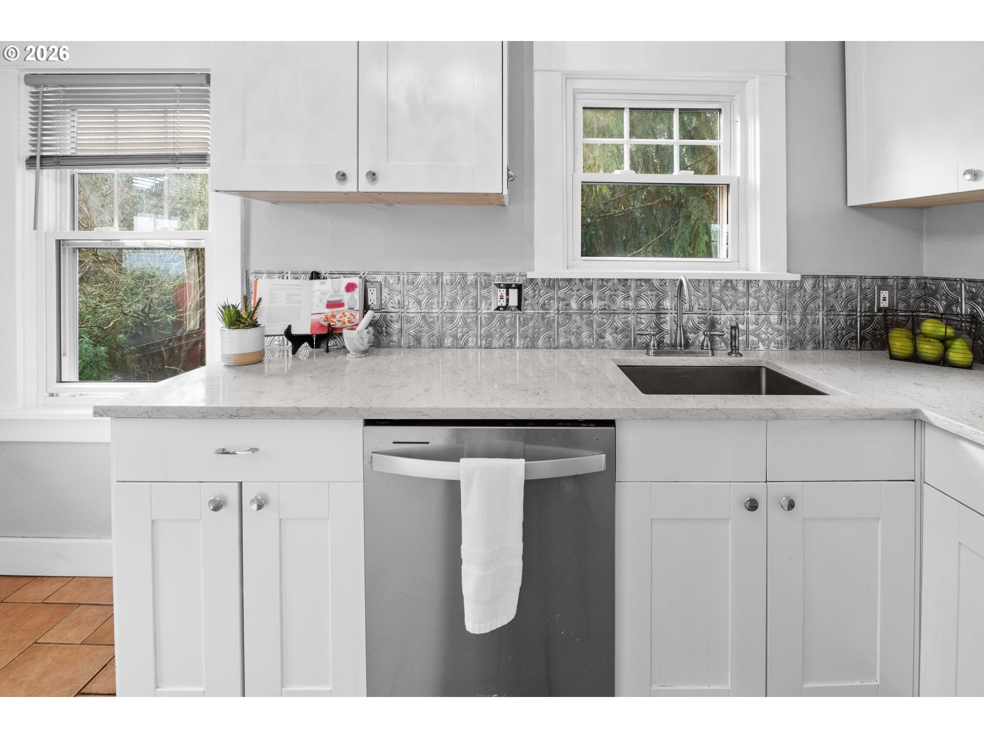 1014 8th Street Astoria, OR 97103 - Photo 11 of 25 a kitchen with sink cabinets and a window