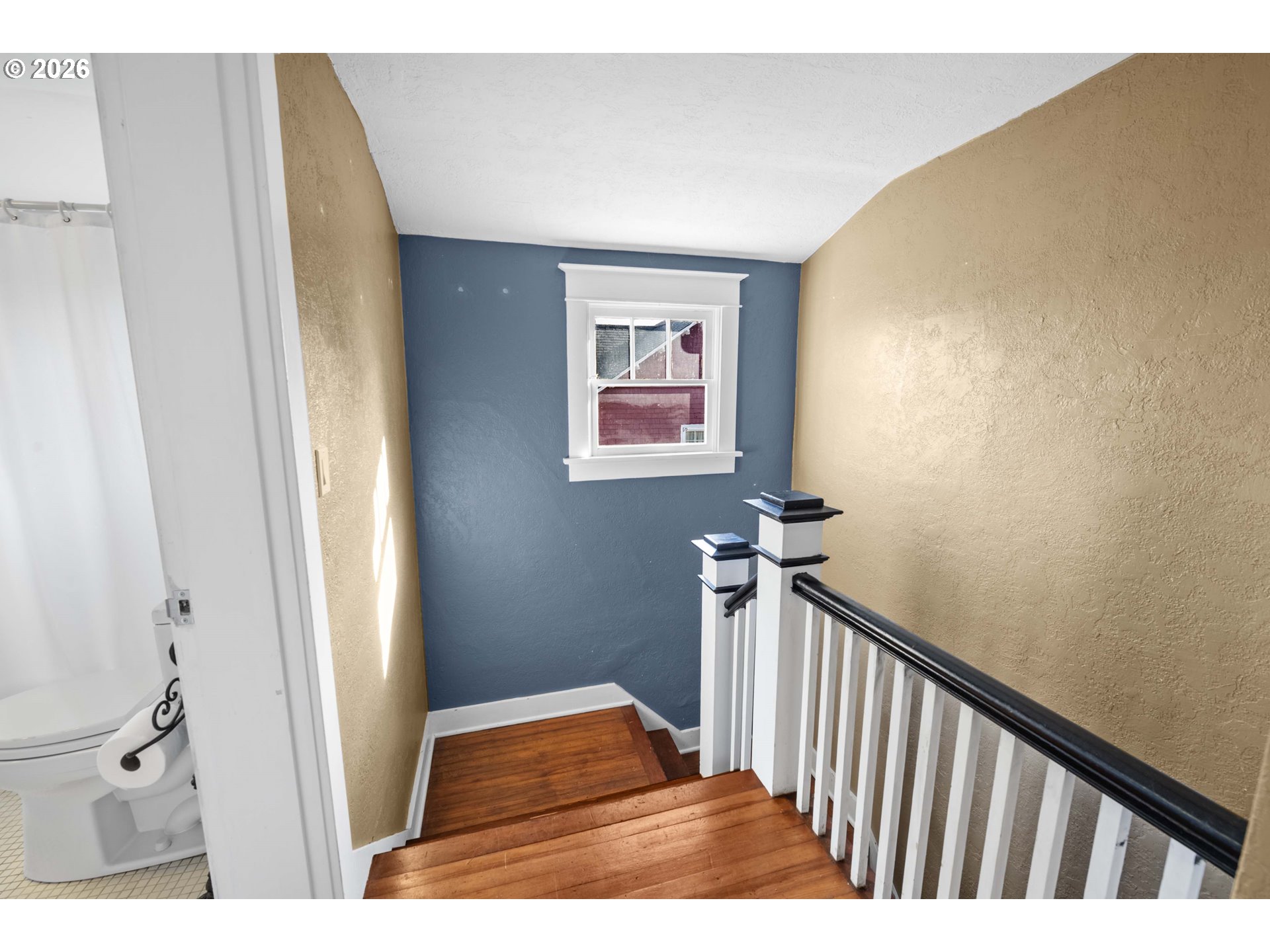 1014 8th Street Astoria, OR 97103 - Photo 13 of 25 a view of a hallway with wooden floor and staircase