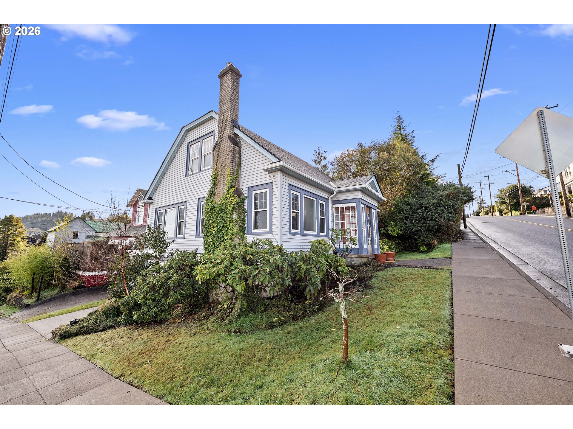 1014 8th Street Astoria, OR 97103 - Photo 21 of 25 a front view of a house with a garden