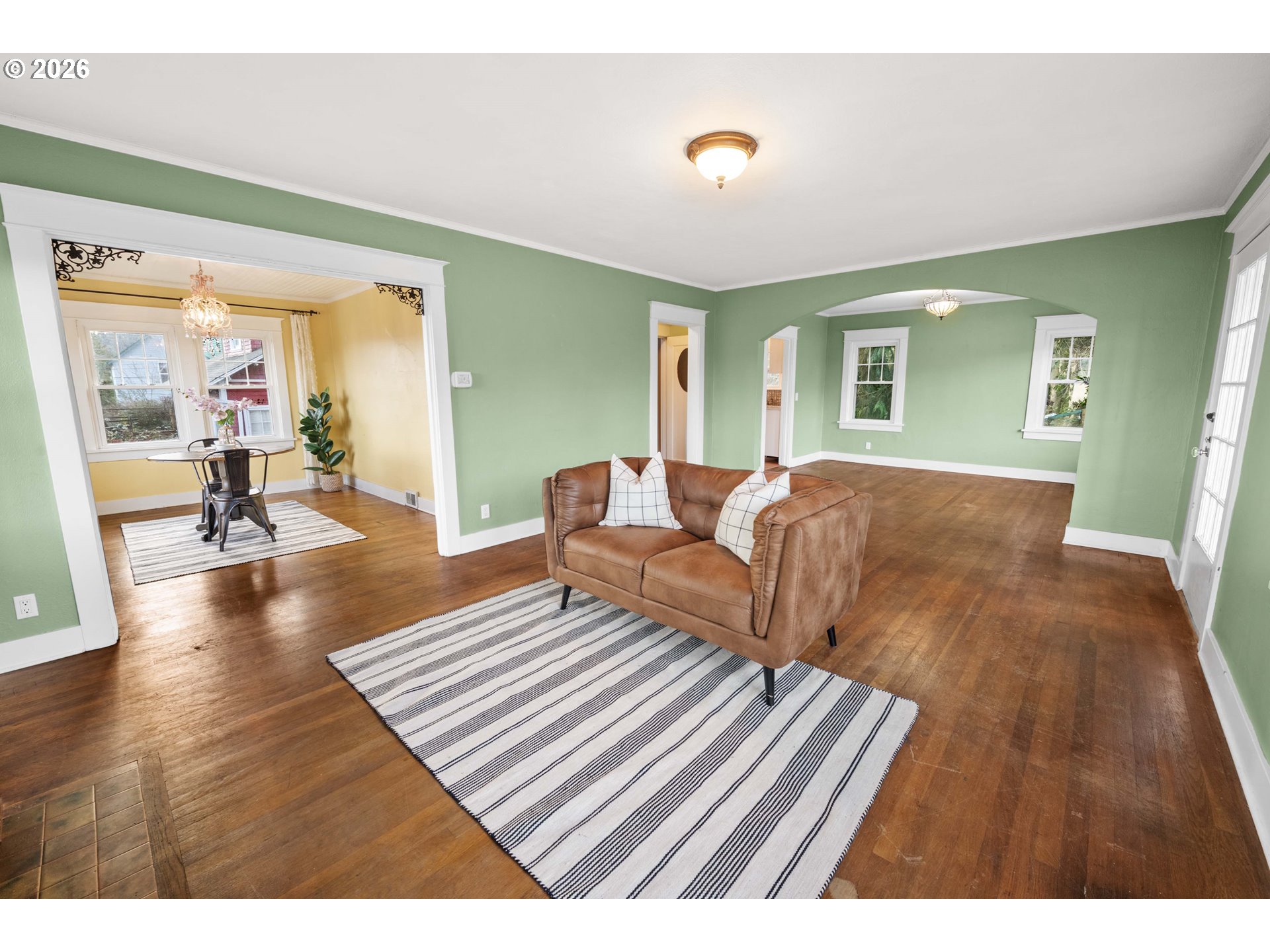 1014 8th Street Astoria, OR 97103 - Photo 3 of 25 a living room with furniture and a wooden floor