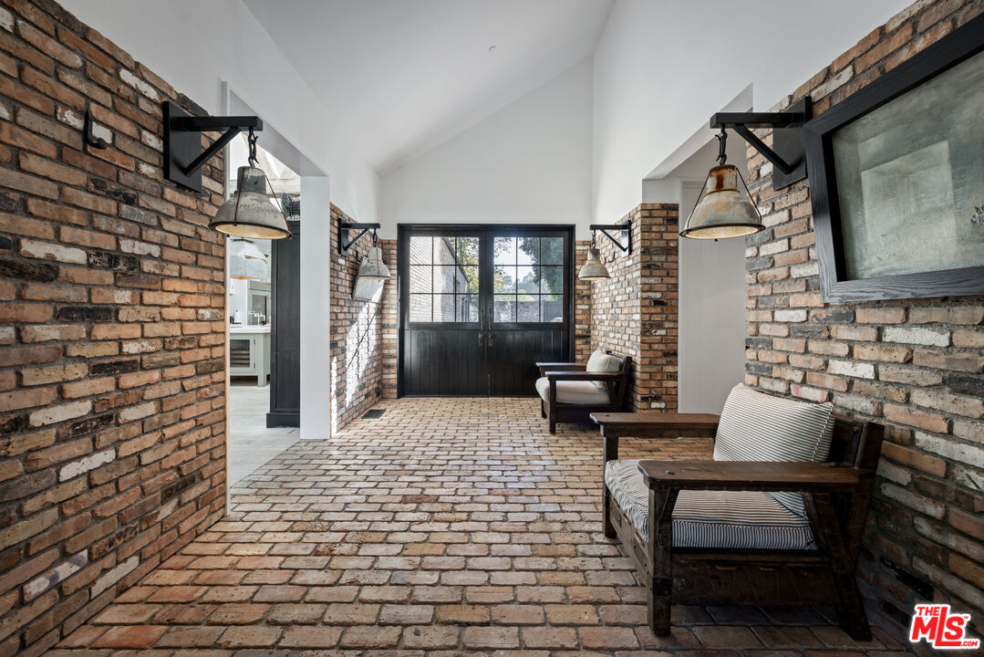 13215 Riviera Ranch Road Los Angeles, CA 90049 - Photo 14 of 37 a living room with furniture and a fireplace