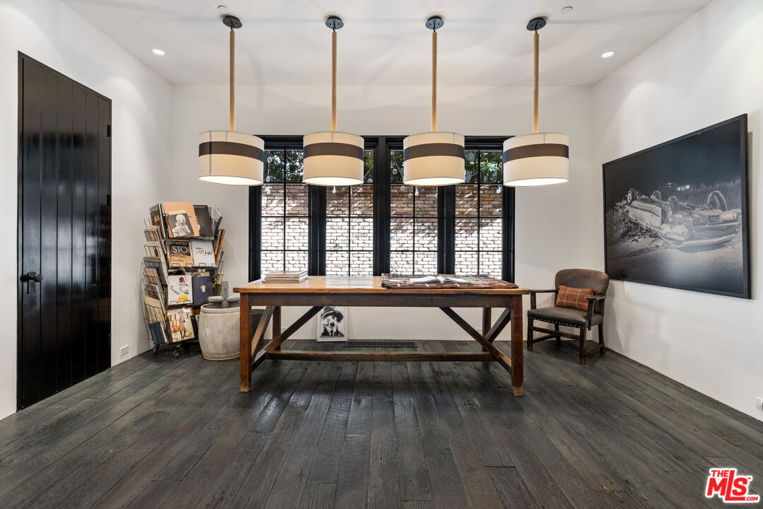13215 Riviera Ranch Road Los Angeles, CA 90049 - Photo 15 of 37 a view of a dining room with furniture window and wooden floor