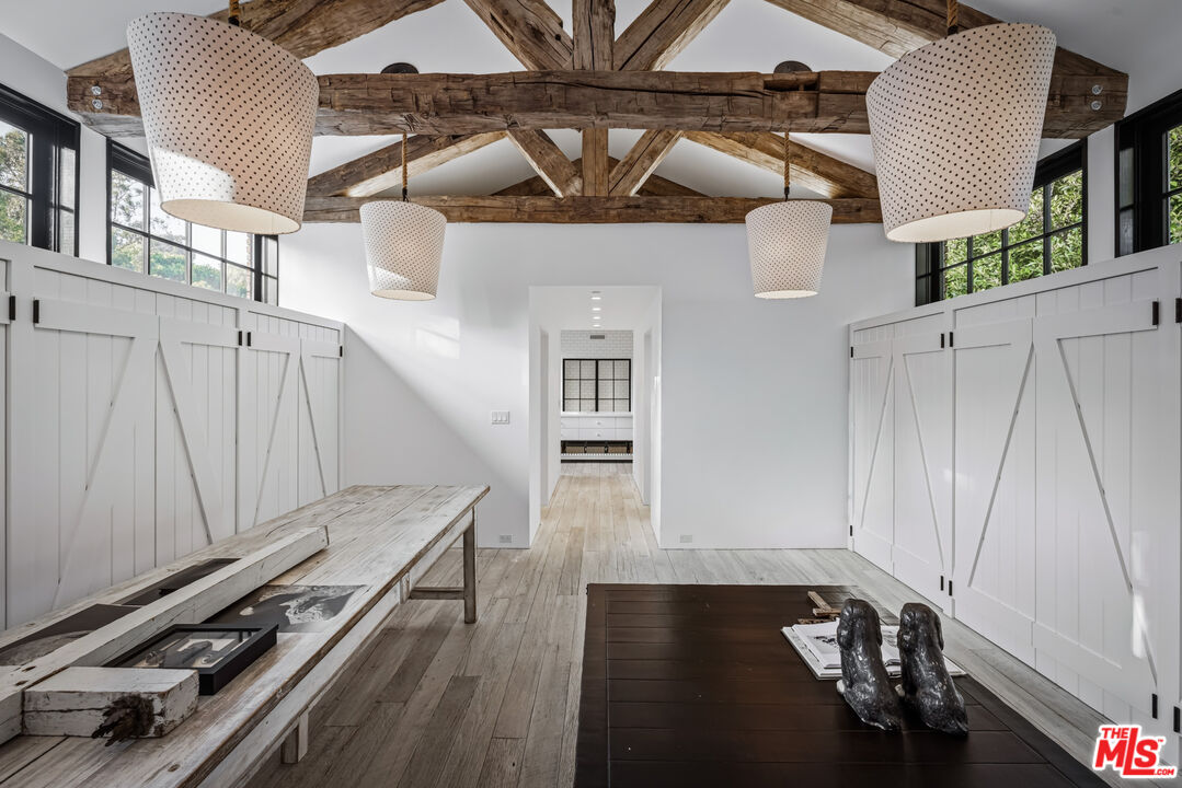 13215 Riviera Ranch Road Los Angeles, CA 90049 - Photo 22 of 37 a view of a entryway with wooden floor