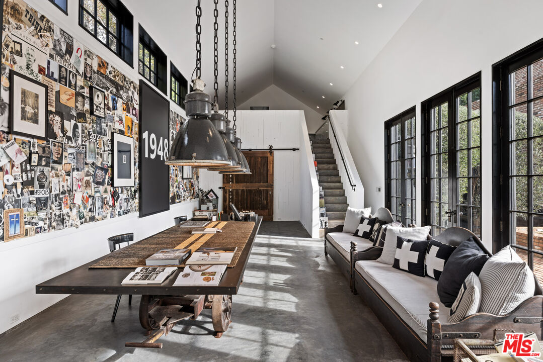 13215 Riviera Ranch Road Los Angeles, CA 90049 - Photo 25 of 37 a outdoor space with lots of furniture and wooden floor