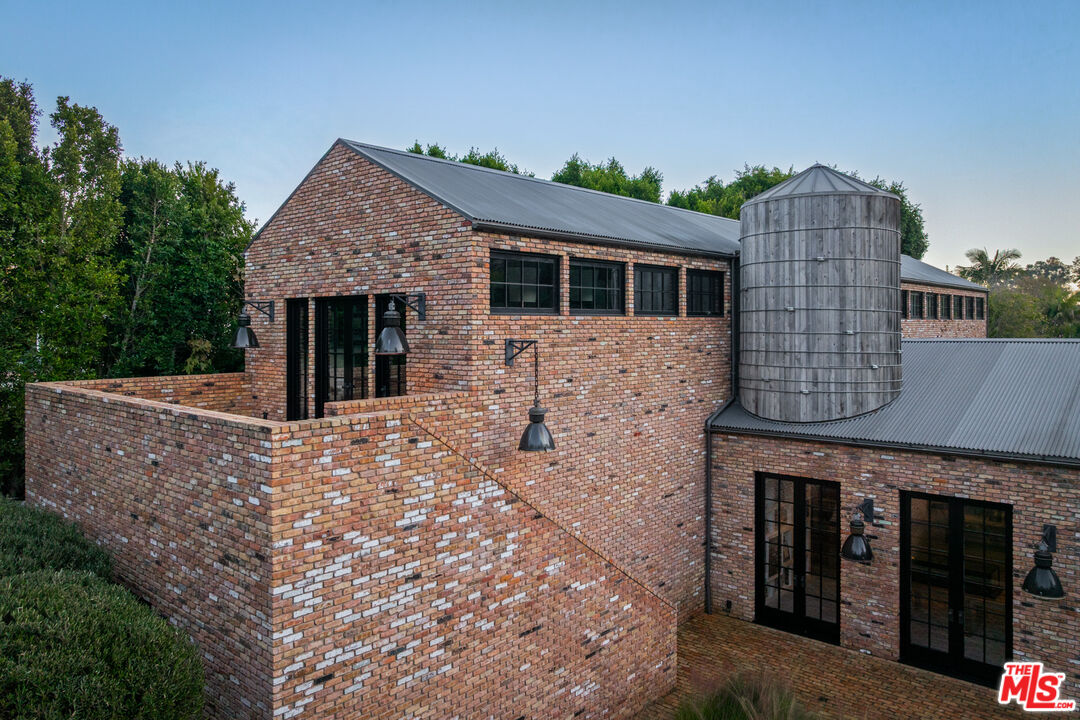 13215 Riviera Ranch Road Los Angeles, CA 90049 - Photo 30 of 37 front view of a house with yard