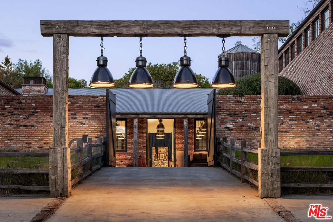 13215 Riviera Ranch Road Los Angeles, CA 90049 - Photo 3 of 37 a view of front door with outdoor space