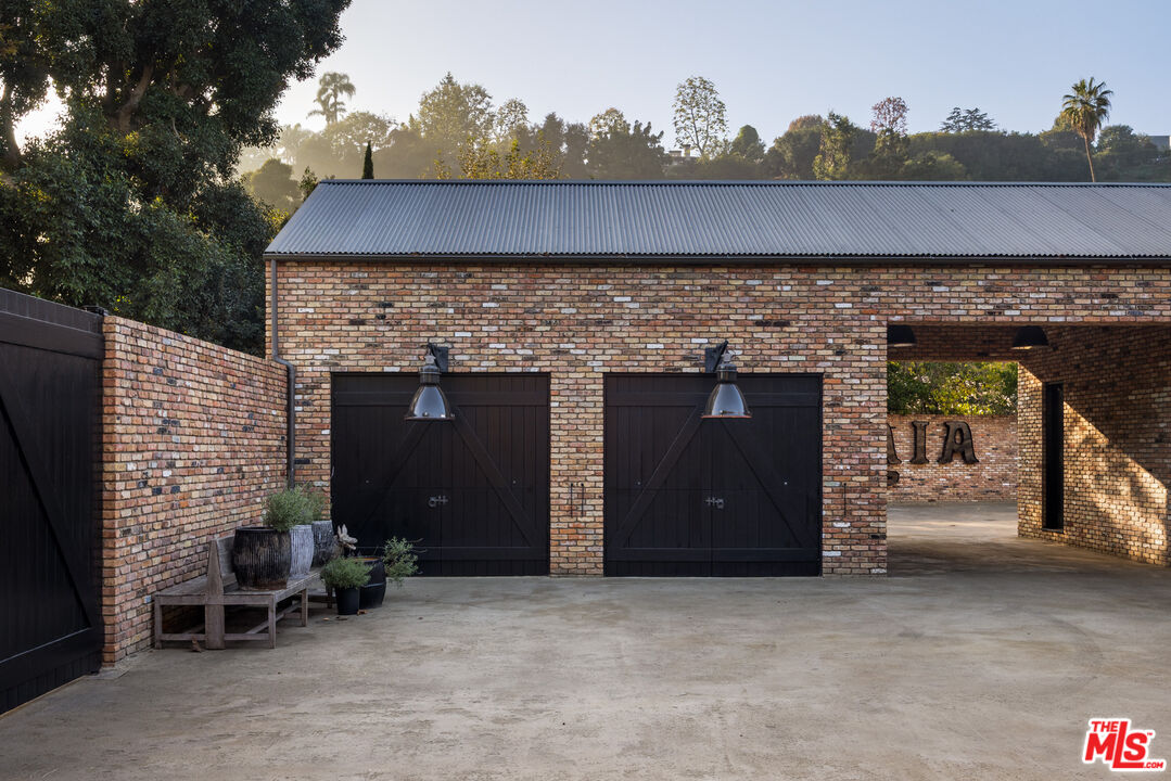13215 Riviera Ranch Road Los Angeles, CA 90049 - Photo 32 of 37 an outdoor view of house with patio