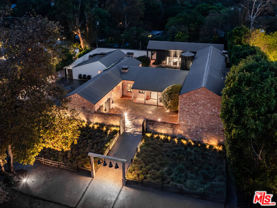 13215 Riviera Ranch Road Los Angeles, CA 90049 - Photo 37 of 37 an aerial view of a house with a yard