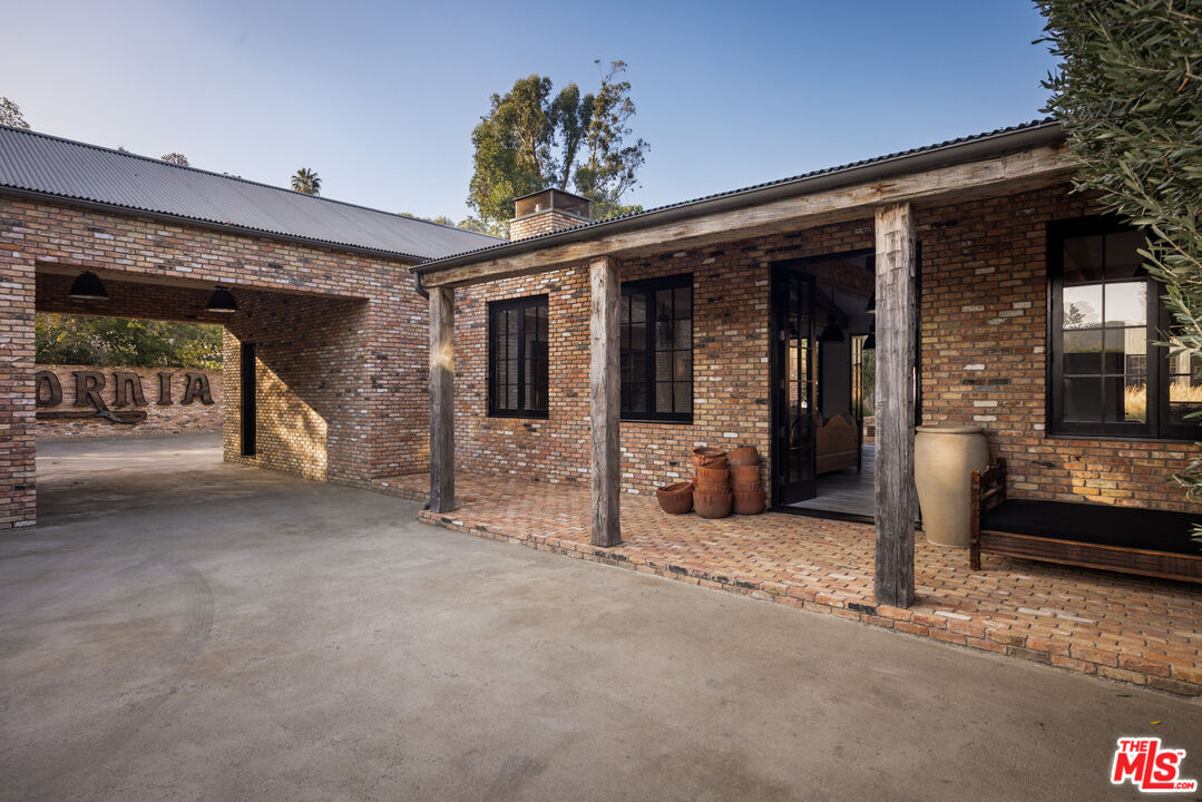 13215 Riviera Ranch Road Los Angeles, CA 90049 - Photo 4 of 37 a view of a porch