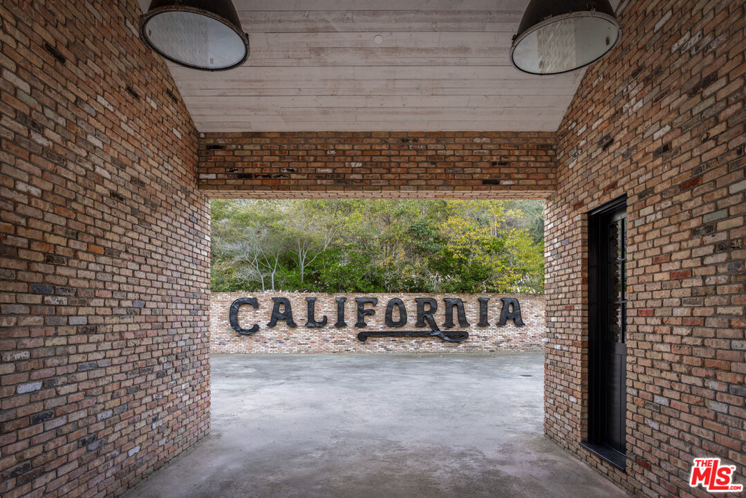 13215 Riviera Ranch Road Los Angeles, CA 90049 - Photo 5 of 37 a bathroom with a sink and a shower