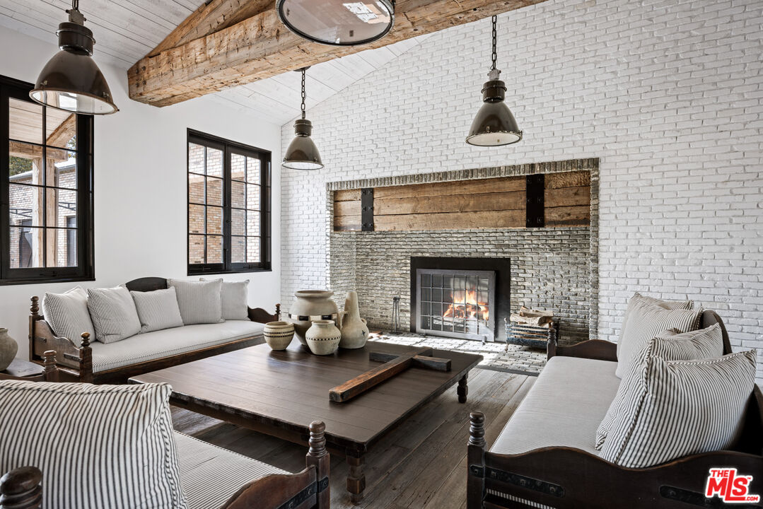 13215 Riviera Ranch Road Los Angeles, CA 90049 - Photo 7 of 37 a living room with furniture and a fireplace