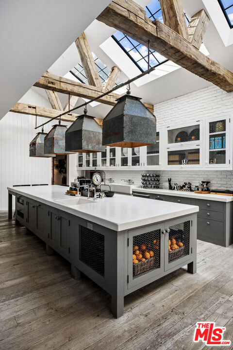13215 Riviera Ranch Road Los Angeles, CA 90049 - Photo 9 of 37 a kitchen with stainless steel appliances granite countertop a stove and a sink