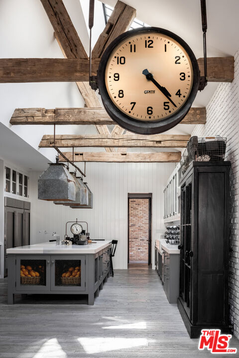 13215 Riviera Ranch Road Los Angeles, CA 90049 - Photo 10 of 37 a view of a kitchen with a stove and a clock
