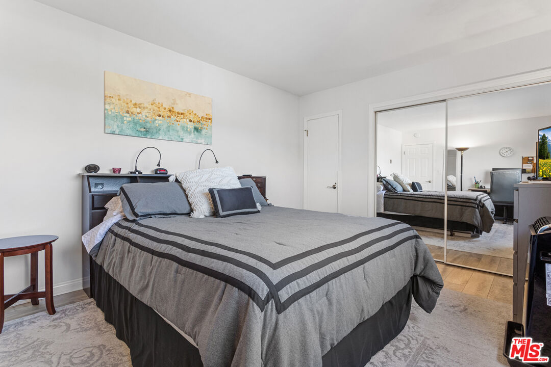 2002 4th Street, Unit 312 Santa Monica, CA 90405 - Photo 16 of 22 a bedroom with bed and wooden floor