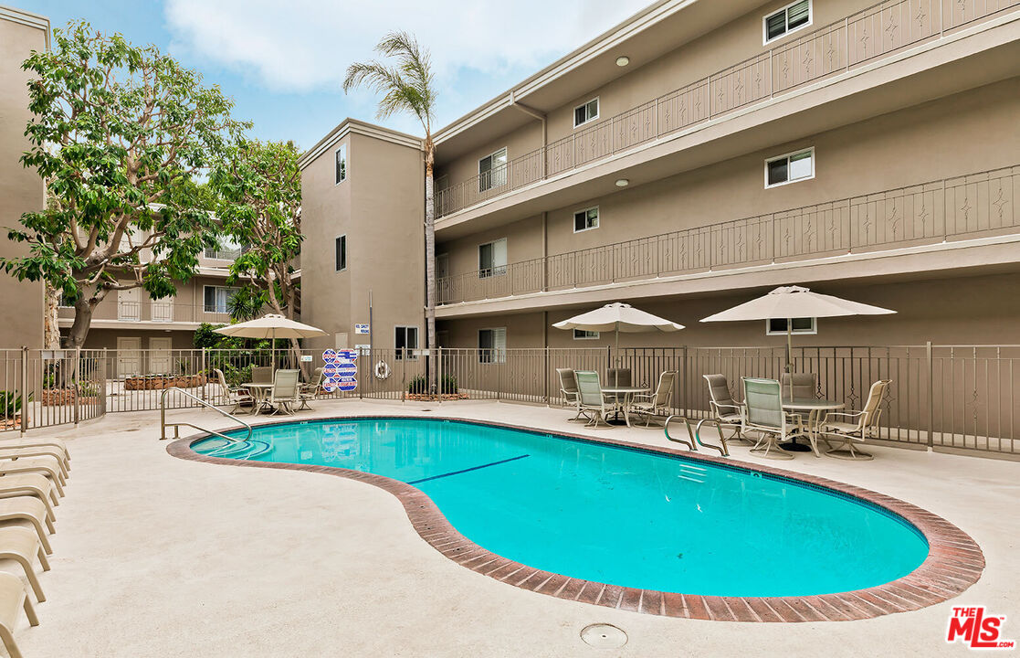 2002 4th Street, Unit 312 Santa Monica, CA 90405 - Photo 20 of 22 a view of a swimming pool with chairs