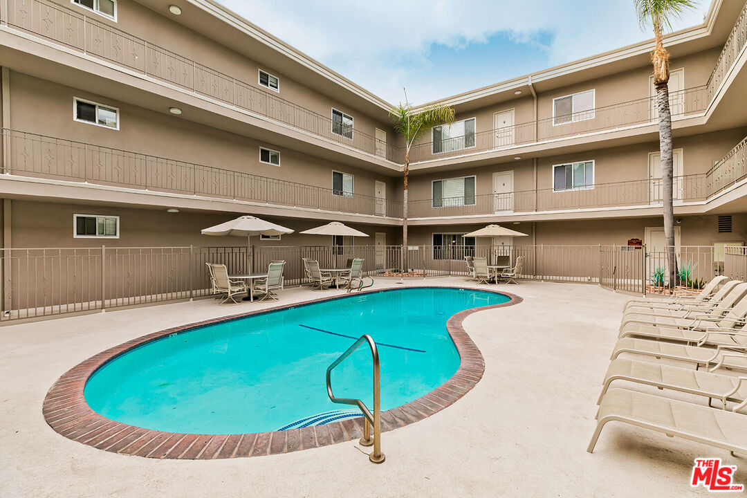 2002 4th Street, Unit 312 Santa Monica, CA 90405 - Photo 22 of 22 a view of a swimming pool with a chairs