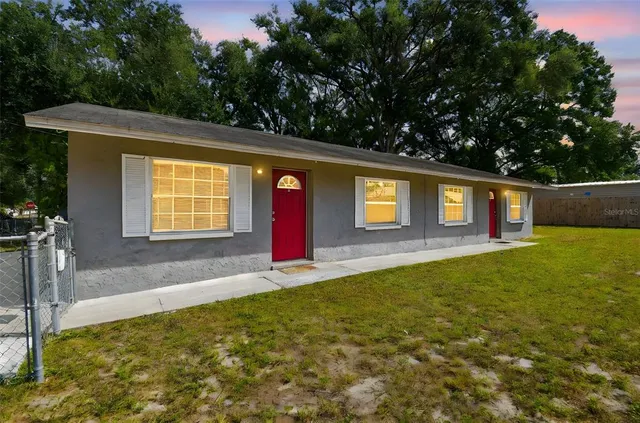 a view of pool with a yard