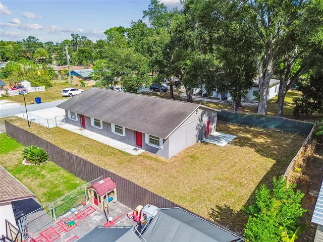an aerial view of a house with swimming pool